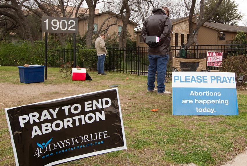 Several volunteers pray outside a South Austin clinic where abortions are performed as part of the pro-life campaign 40 Days for Life