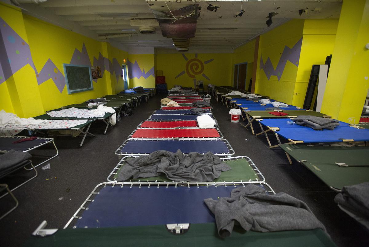 Cots set up inside the Travis Park Church June 27, 2019 in downtown San Antonio where an influx of migrants mostly from Africa have been arriving in the city. The shelter includes volunteers from the Interfaith Welcome Coalition