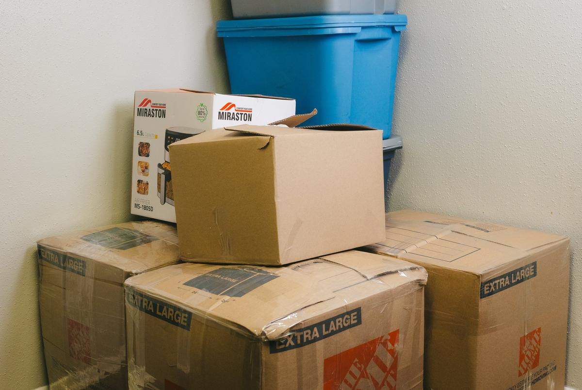 Boxes packed with clothing and household goods in the Venezuelan family’s San Antonio home. The family started keeping many of their belongings boxed up and ready to ship out of fear of deportation.