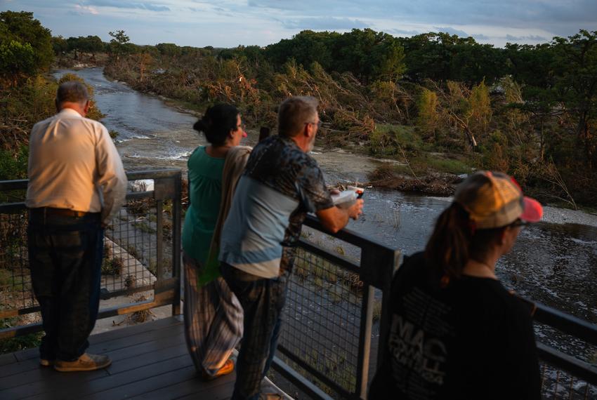 People gather at pavilion overlooking the Guadalupe River following a vigil for the victims of the Kerr County flood on Friday, July 11, 2025, in Kerrville.