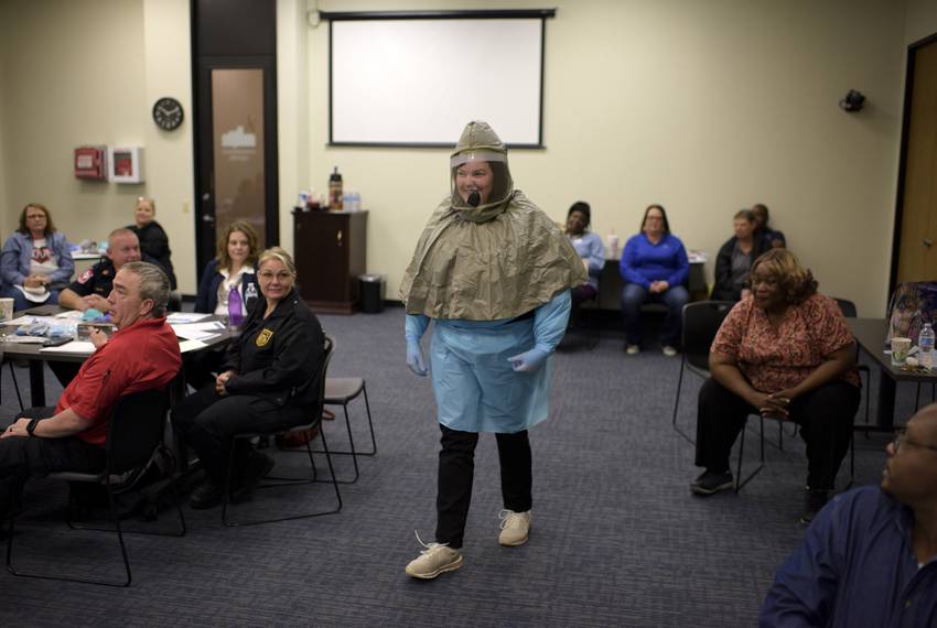 Nurse educator Tanya Bosque wear protective equipment during a personal protection equipment training session in Houston o...
