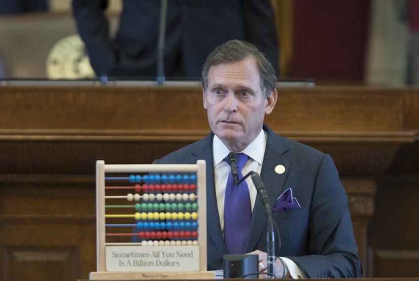 House Appropriations Committee chairman John Zerwas lays out the budget with an abacus as a prop. The plaque reads, "Sometimes All You Need Is A Billion Dollars."