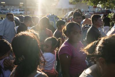 Asylum seekers wait in line to get a meal provided by Team Brownsville near the Gateway International Bridge in Matamoros, Mexico on Sunday, Oct. 13, 2019. Most of the people have been sent back under the Migrant Protection Protocols, MPP, also known as “Remain in Mexico” program along with some Mexican nationals awaiting their turn to seek asylum in the U.S.
Verónica G. Cárdenas for The Texas Tribune