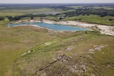 Leaving the mound of excavated dirt in place would save the company both time and money. A reclamation expert estimated it would cost as much as $4 million to remove it.