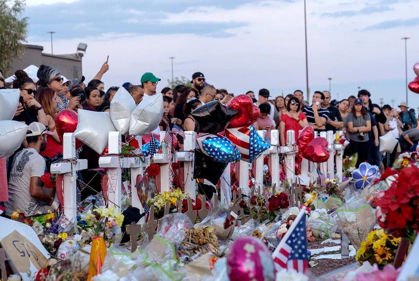 Hundreds mourn for the victims and their family outside the El Paso Walmart where a mass murderer killed 22 people.