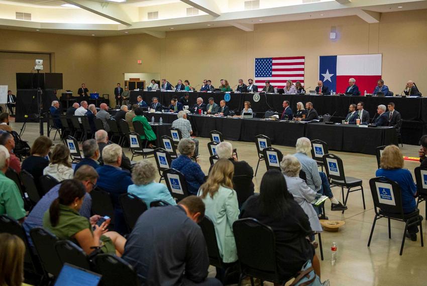People listen in to a panel of local Kerr County officials testify during a joint committee hearing at the Hill Country Youth Event Center in Kerrville on Thursday, July 31, 2025.