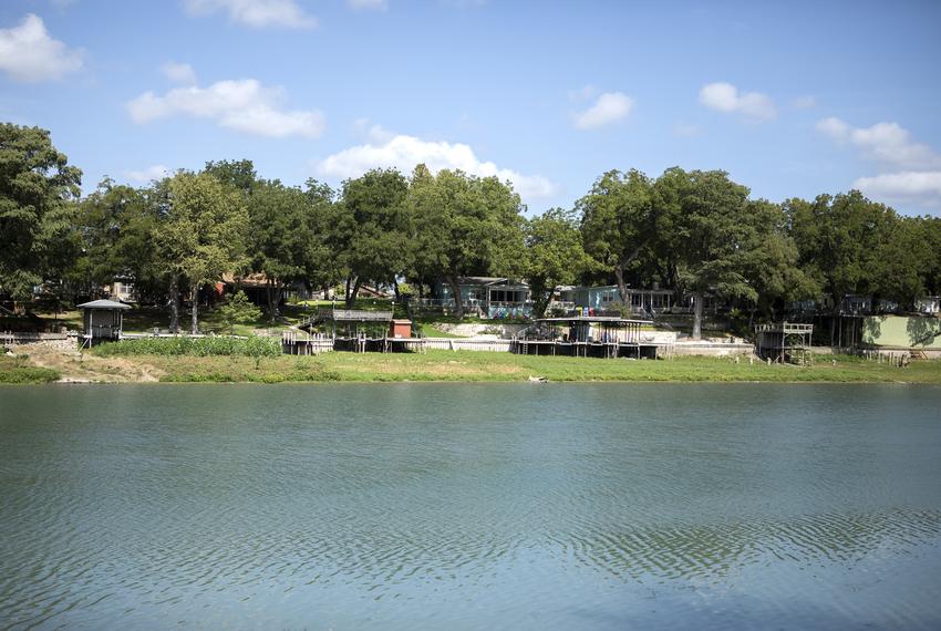 A row of boat launches sit over land on Lake Dunlap on Aug. 30, 2019. The structures used to sit over the lake until a recent dam failure caused the lake to recede. 