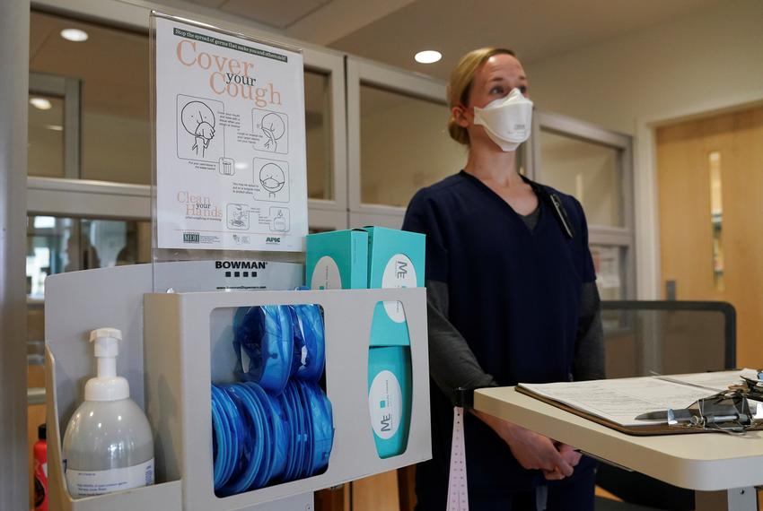 Staff nurse Lt. Gretta Walter awaits the arrival of coronavirus test patients in the emergency room at Fort Belvoir Community Hospital in Fort Belvoir, Virginia on March 18, 2020.