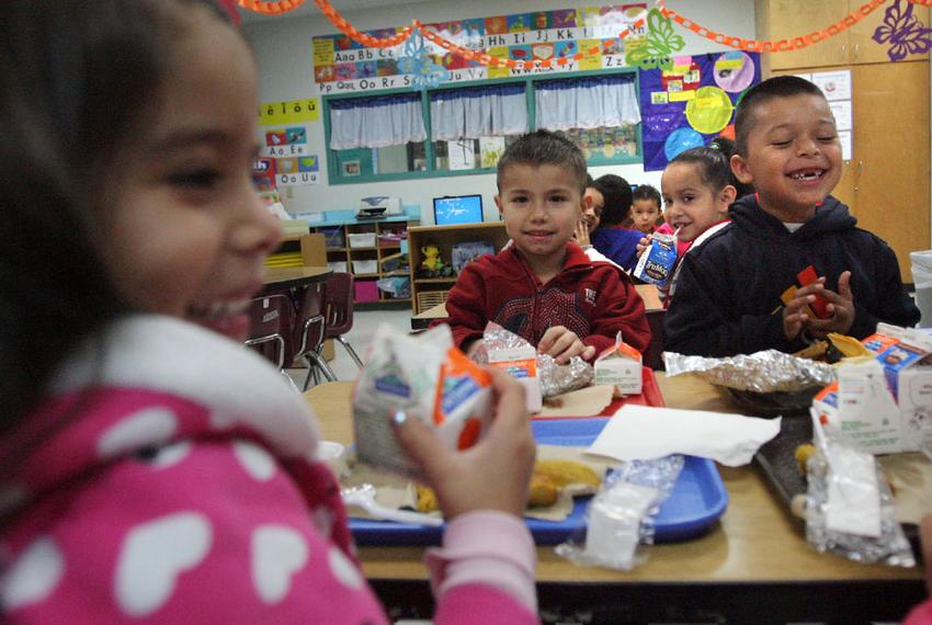 School children at Arnoldo Cantu Sr. Elementary School in San Juan, Texas, enjoy their free breakfast, April 24, 2013.