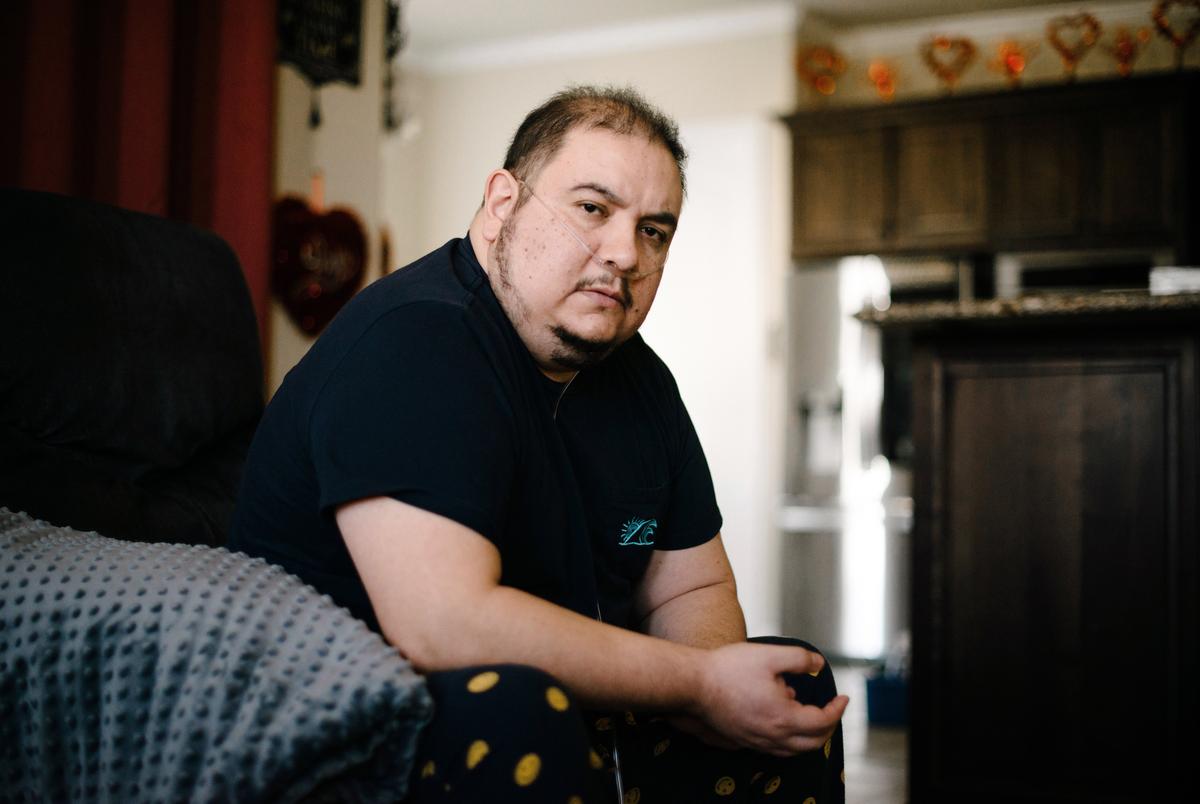 RICHMOND, TX - MARCH 3:  Mauricio Marin poses for a portrait at his home in Richmond, TX, on Wednesday, March 3, 2021.Mauricio Marin thought his worst days were behind him after his month-long stay in a Covid ICU late last year. Doctors sent the 44-year-old home to his wife and kids in Fort Bend County with oxygen tanks, a CPAP machine and strict instructions to avoid cold weather and the flu. But after four days mostly without power, no heat and inadequate oxygen that left him gasping for air, he told his wife, ‚ÄúHoney, at least I‚Äôm going to die with you and my kids and not alone at the hospital.‚Äô‚Äù Marin survived the ordeal, only thanks to a neighbor who showed up at the last moment with a backup oxygen tank, but his doctors say days spent shivering in a cold house without supplemental oxygen have vastly set back his already tenuous recovery.