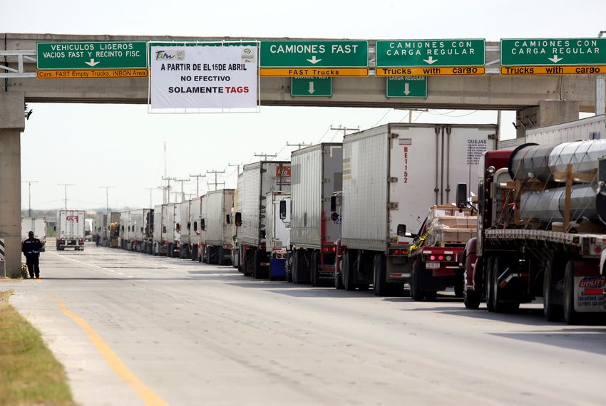 Trucks wait in a long queue for border customs control to cross into U.S. at the World Trade Bridge in Nuevo Laredo, Mexico April 2, 2019.