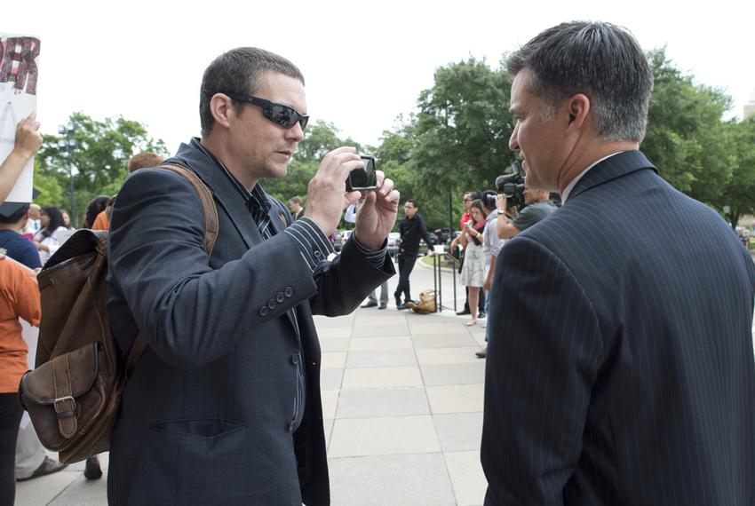 Adam Sharp confronts State Rep. Roland Gutierrez, D-San Antonio, at the Texas Capitol on Thursday, May 21, 2015.