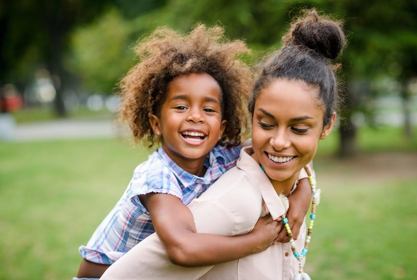 Mother and daughter having fun at the park