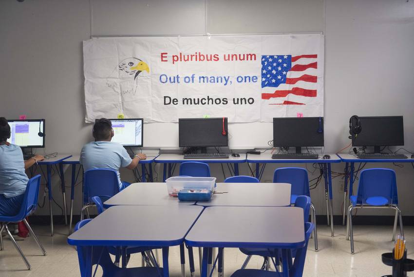Dilley, TX August 23, 2019: Childrenwork in the modest computer lab located at U.S. Immigration and Customs Enforcement's (ICE) South Texas Family Residential Facility outside Dilley. The 55 acre campus is currently home to about 900 mothers and children awaiting immigration or deportation hearings.