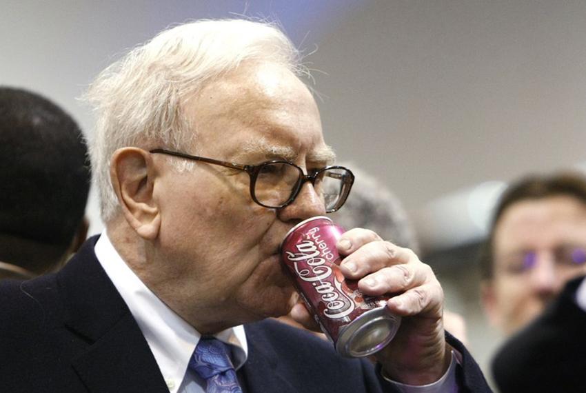 Berkshire Hathaway Chairman Warren Buffett drinks a soft drink at the Berkshire Hathaway annual meeting in Omaha, Nebraska on May 1, 2010.