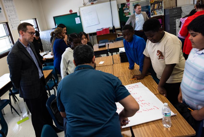 Texas Education Commissioner Mike Morath watches a group of seventh graders read a poem in Fort Worth ISD’s William James Middle School on Aug. 28, 2025.