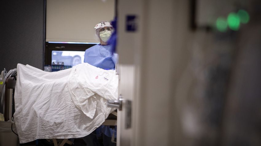 A nurse checks on a patient in the COVID-19 unit at Doctors Hospital at Renaissance Health System in Edinburg.