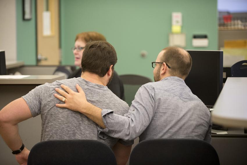 A couple arranges a marriage license at the Travis County Clerk's office on June 26, 2015.