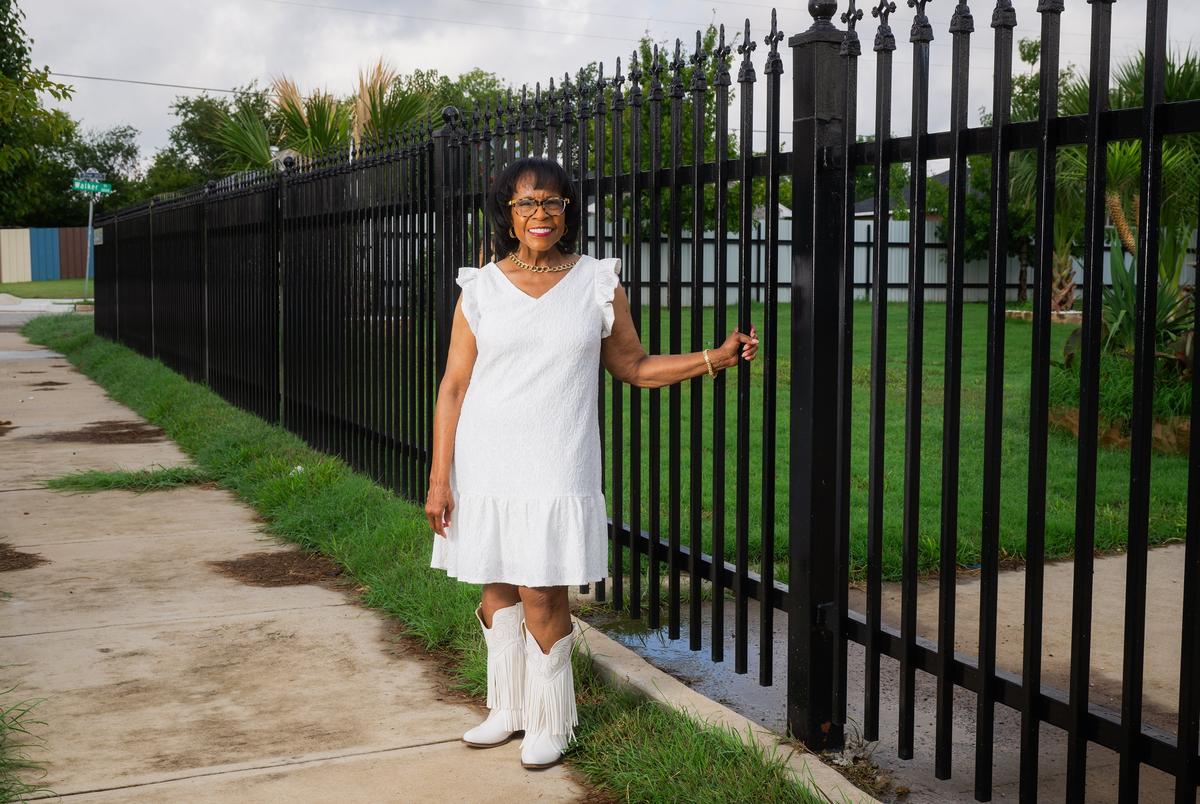 FORT WORTH, TEXAS — SEPTEMBER 1, 2025: Gyna Bivens, a former Fort Worth City Council member representing District 5 and former mayor pro tem, poses for a portrait outside a residence in the Stop Six neighborhood of Fort Worth, Texas, on Monday, Sept. 1, 2025. Ms. Bivens played a key role in shaping zoning laws, including overturning historic overlay zoning to encourage new housing development in her district. CREDIT: Desiree Rios for The Texas Tribune