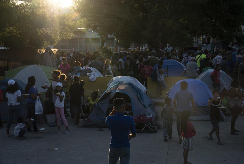 Asylum seekers wait in line to get a meal provided by Team Brownsville near the Gateway International Bridge in Matamoros, Mexico on Sunday, Oct. 13, 2019. Most of the people have been sent back under the Migrant Protection Protocols, MPP, also known as “Remain in Mexico” program along with some Mexican nationals awaiting their turn to seek asylum in the U.S.