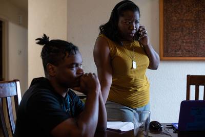 Jaquita Wilson-Kirby, Thomas Williams-Platt’s aunt, speaks with his school’s front office to clear up confusion surrounding paperwork due for her 18-year-old nephew to graduate in Georgetown on Nov. 22, 2019. 