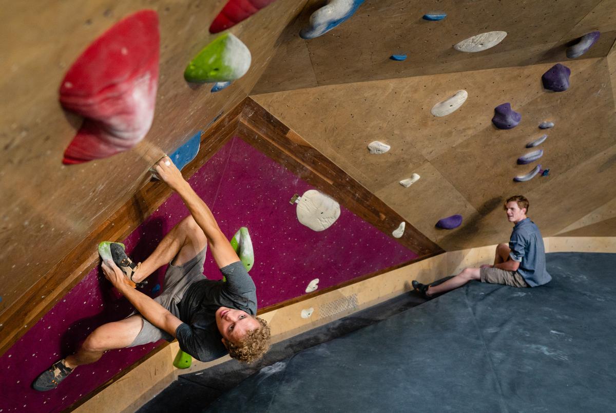 From left: Justin McGrath, 21, and Jonah Brenner, 22, boulder at Crux Climbing Center in South Austin on June 14, 2021.
