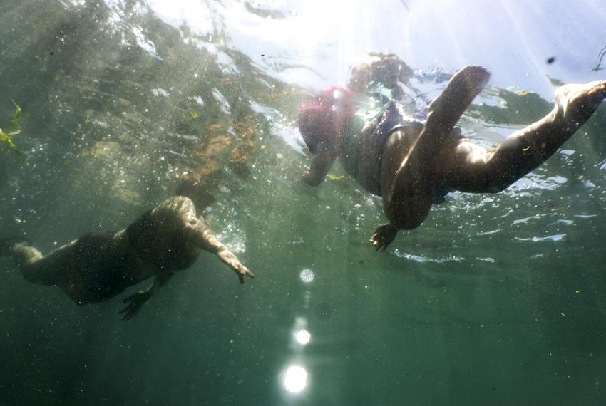 Swimmers in the San Marcos River on Sunday, June 13, 2021.