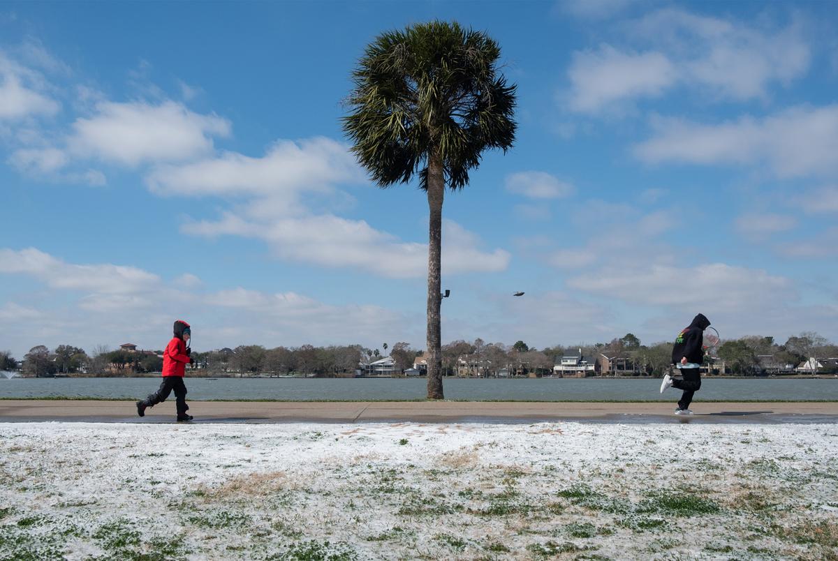 A handful of people visited the park with tennis rackets in hand on Feb. 15, 2021 in Houston. A rare snow blanketed the city as well as other parts of Texas.