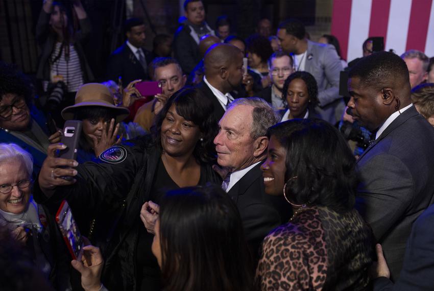 Democratic presidential  candidate Mike Bloomberg takes photos with supporters during a campaign event at the Buffalo Soldier Museum in Houston on Thursday, Feb. 13, 2020.