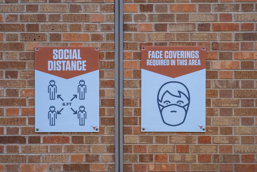 Signs encouraging mask wearing and social distancing were posted around the stadium.