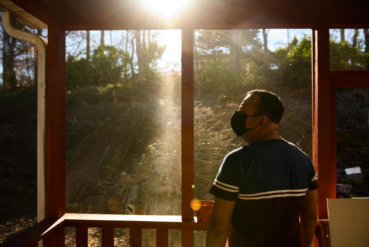 Gabriel, identified under a pseudonym to protect his identity, at his home in Greer, South Carolina, on Dec. 12, 2021. Gabriel sought asylum at the El Paso-Ciudad Jaurez border after fleeing Venezuela in 2019 for speaking against President Nicolás Maduro. He moved to South Carolina after winning his asylum case.