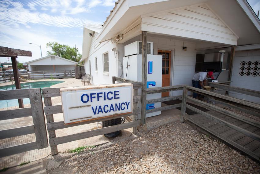 Cotulla Motel employee Jared Ramirez bags ice on April 7, 2016. Ramirez began working at the motel after work in the oil fields dried up.