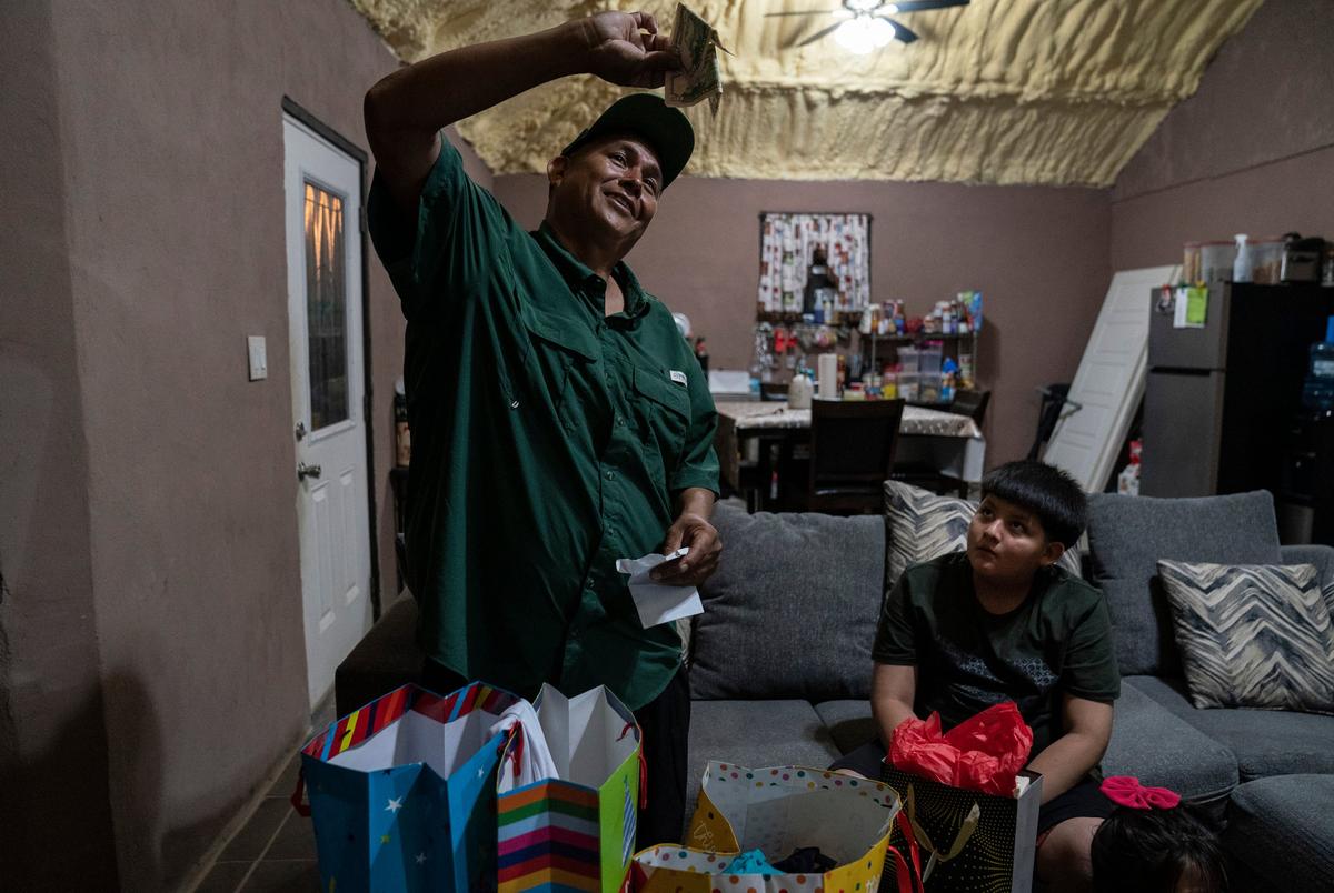 Jaime Galván-Sánchez shows the money that he got as a present during his birthday party celebration at his home in Mercedes, Texas on March 8, 2025. 
Gabriel V. Cárdenas for The Texas Tribune