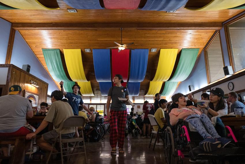 Campers and counselors sit down for breakfast at Camp CAMP, a summer camp hosted by Children’s Association for Maximum Potential for people with disabilities, on Tuesday, July 22, 2025, in Center Point.