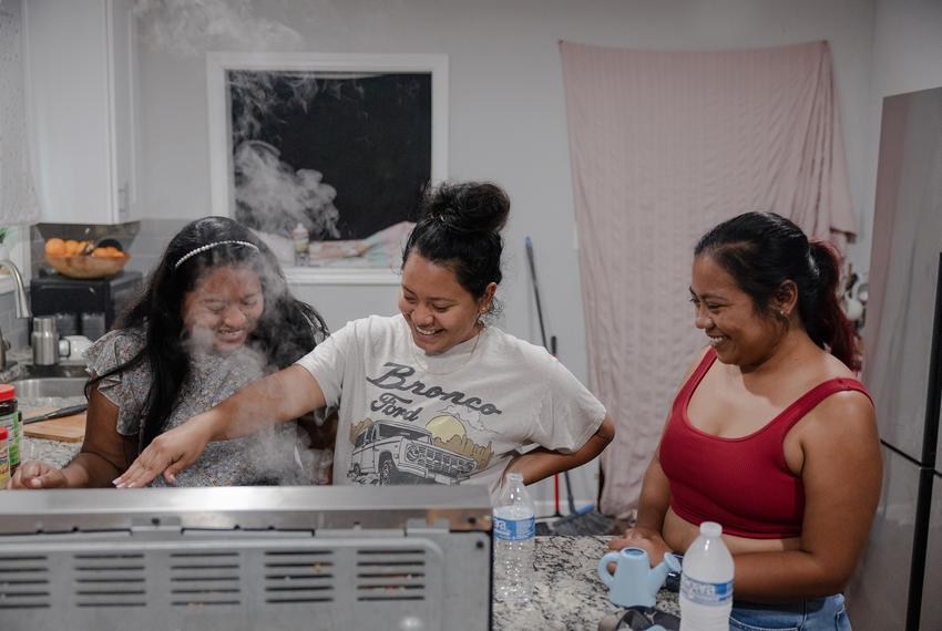 From left: Ester, Abigail and Lisbet talk as they cook at Abigail’s house on Tuesday, June 10, 2025, in Houston. The family gathered to wait for news of Margarita Avila’s interview today at the detention center.

(Lexi Parra for The Texas Tribune)