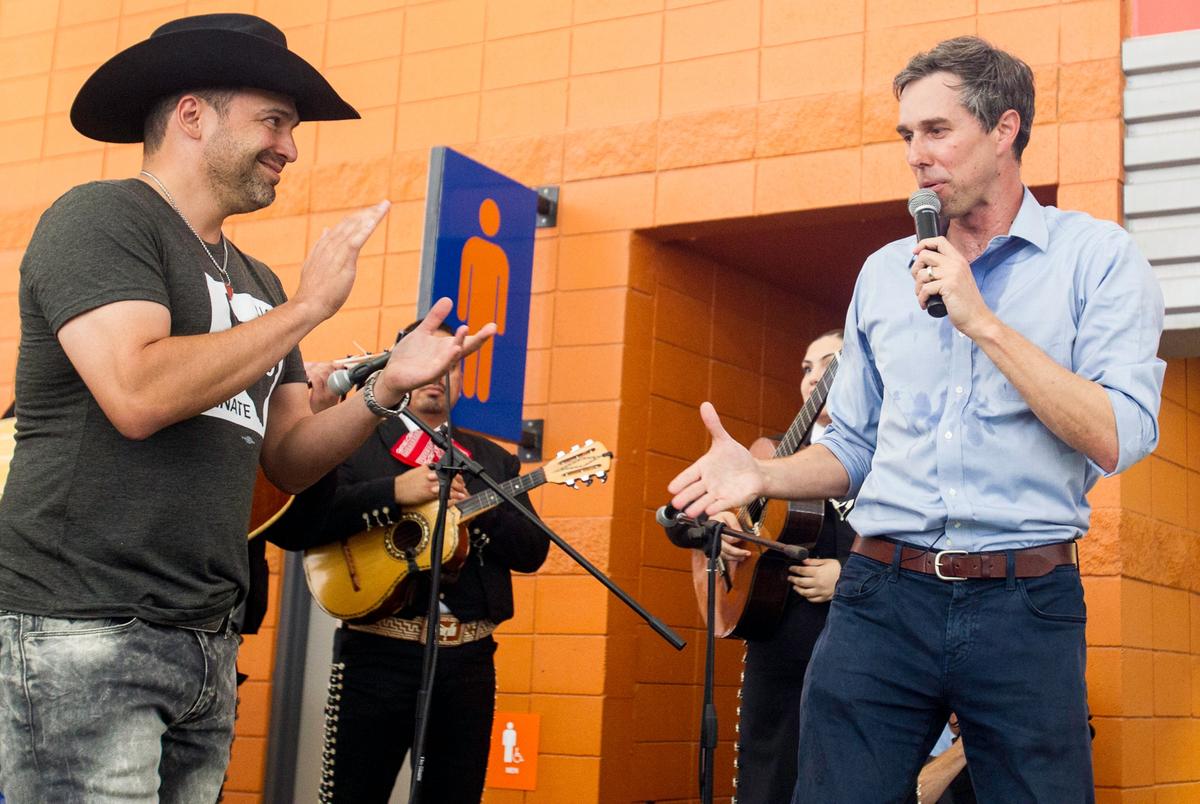 Tejano music star Bobby Pulido joins then-Senate candidate Beto O'Rourke during a campaign rally at HEB Park in Edinburg on May 1, 2018.