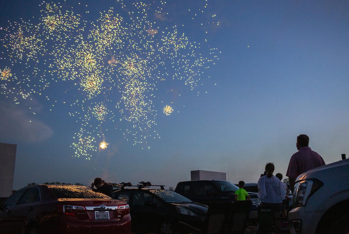 Families attend a fireworks show at Doc’s Drive-in Theatre in Buda to celebrate the Fourth of July holiday.