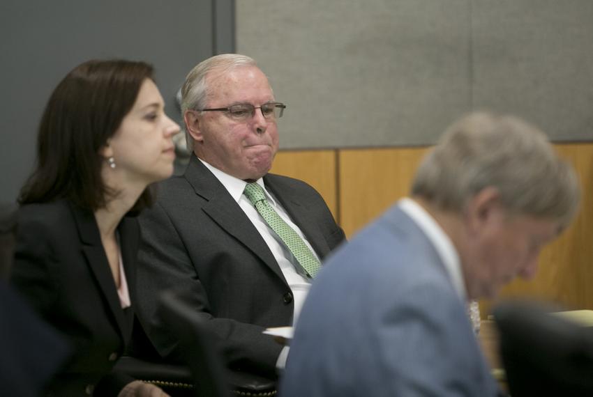 Former CPRIT executive Jerry Cobbs sits inside the 147th District Court with attorneys Jenny Brevorka and Rusty Hardin before opening arguments in his trial on Aug. 18, 2015.