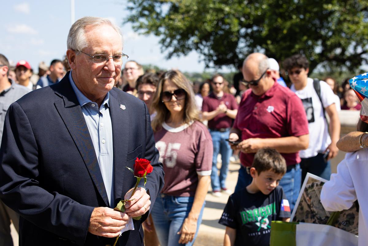 President Mark A. Welsh III and his wife Betty are greeted by A&M faculty and students as he leaves campus after resigning on Sept. 19, 2025.
