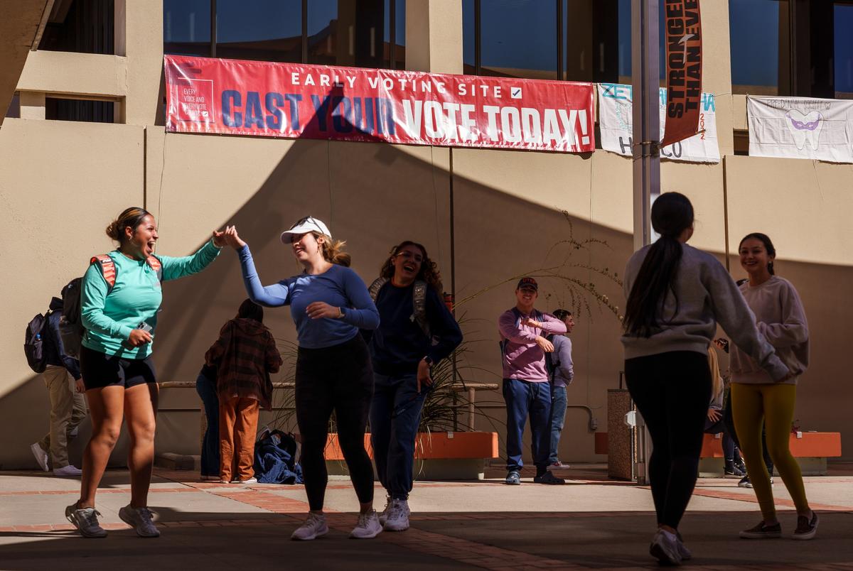 Dance majors from the Department of Theater and Dance perform under a banner encouraging students to vote at the Union Building at the University of Texas at El Paso in El Paso on Oct. 25, 2022.