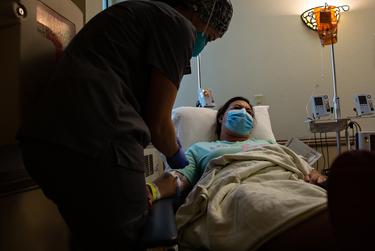 Nurse practitioner Cheryl Shovan assists Melissa Skeen with her COVID-19 antibody infusion at the Titus Regional Medical Center in Mount Pleasant on Aug. 19, 2021.