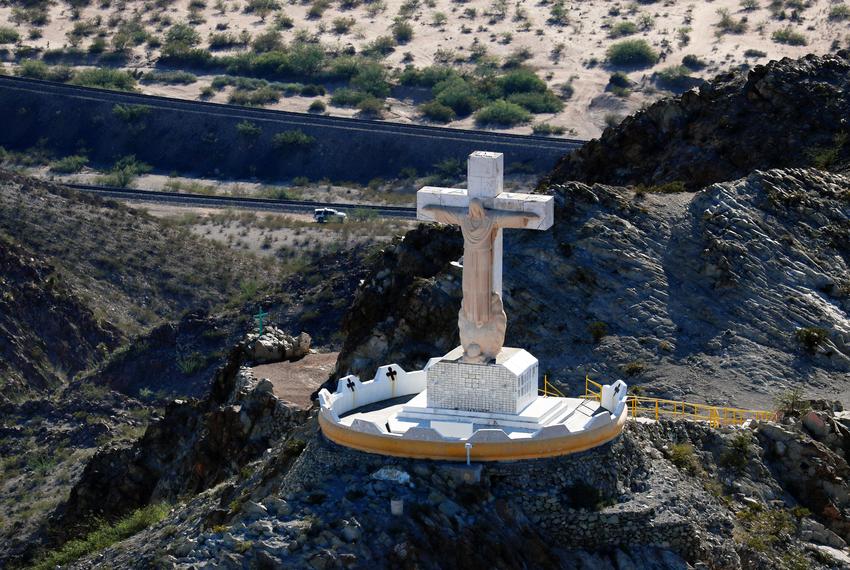 A U.S. border patrol truck drives along the border fence with Mexico and pass the Christo Rey Statue on Mt. Chirsto in  Sunland Park, New Mexico, U.S. June 18, 2018.