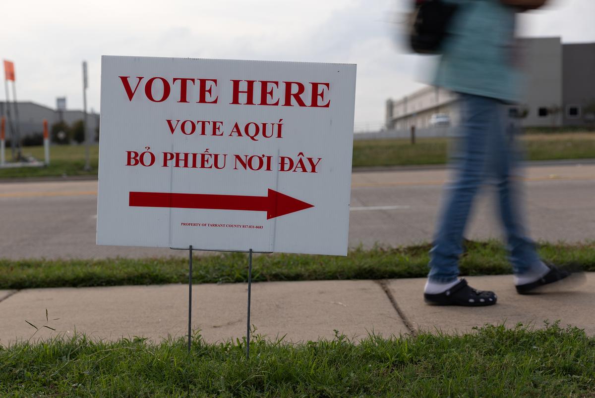 Voters wait in line to cast their ballots on Election Day at the Blue Mound City Hall in Blue Mound on November 8, 2022.