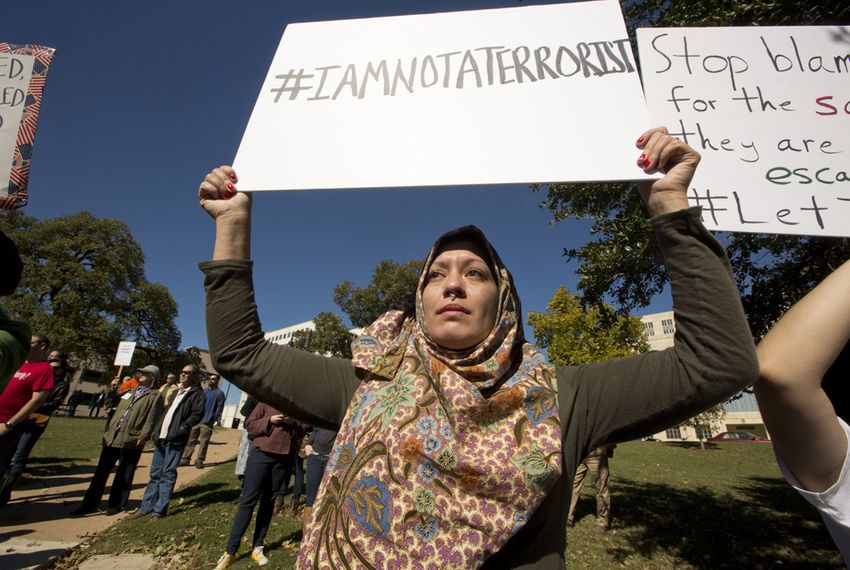 Houston resident Jazmine Myluhu attends a rally to protest Gov. Abbott's decision on Syrian refugees, organized by The Syrian People Solidarity Group. Nov. 22, 2015.
