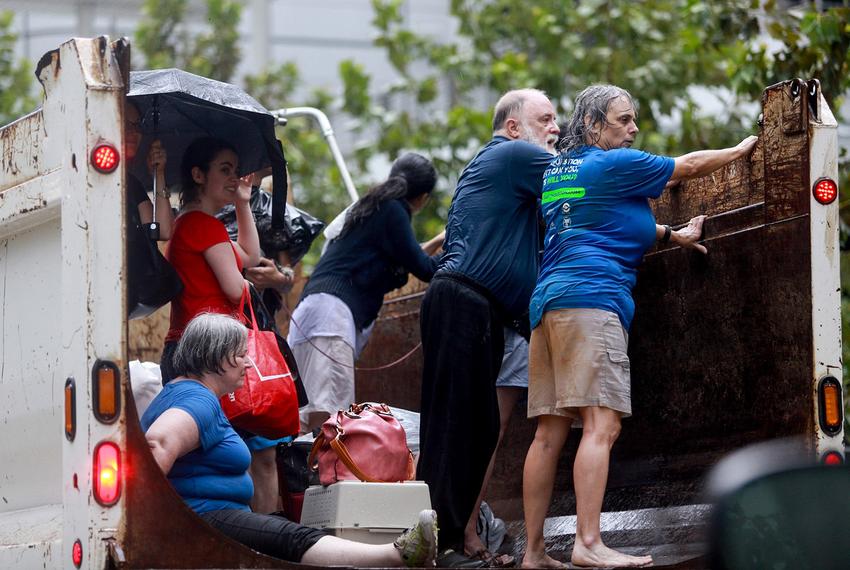 Evacuees from Meyerland — a neighborhood in southwest Houston hit hard by Harvey — arrive at the George R. Brown Convention Center on Sunday, Aug. 27, 2017. 