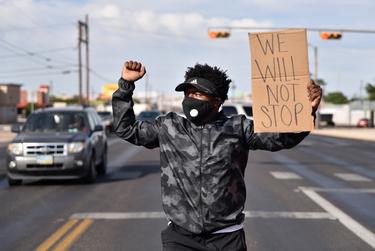 A protester walks down the middle of 8th Street in Odessa during a protest against the death of George Floyd on May 31st, 2020.