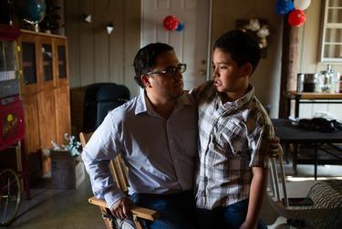 Adam Martinez and his son, Zayon, 8, at their home in Uvalde, on Aug. 12, 2022. Zayon was present at Robb at the recent school shooting, and will not be returning to in-person classes for the upcoming school year, instead choosing to use the online schooling option.