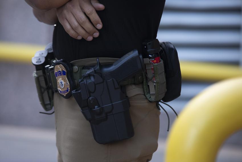A U.S. Immigration and Customs Enforcement (ICE) agent’s badge in front of the J.J. Pickle Federal Building in downtown Austin, Texas, on Tuesday, April 1, 2025.