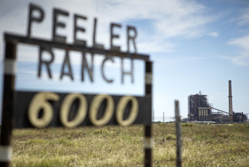 San Miguel Electric Cooperative’s coal-fired power plant is visible from the Peeler family ranch headquarters.