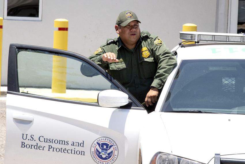 U.S. Border Patrol and McAllen police guard outside the immigrant detention center known as "Ursula" on June 23, 2018.